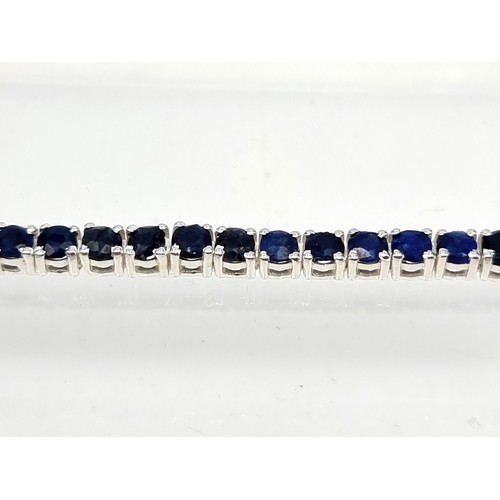 9 - Star lot : A stunning 17 gram natural Blue Sapphire sterling silver tennis bracelet. All stones beau... 