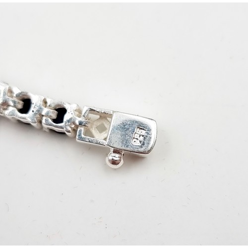 9 - Star lot : A stunning 17 gram natural Blue Sapphire sterling silver tennis bracelet. All stones beau... 