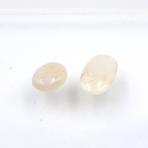 434 - Two natural certified Opal stones, comprising of a White Opal of 6.82 carats. Together with an oval ... 