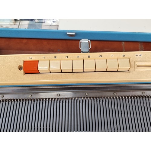 602 - A Jones KH-588 knitting machine, model number 4087175 dating to the 1960's in a lovely sky blue carr... 