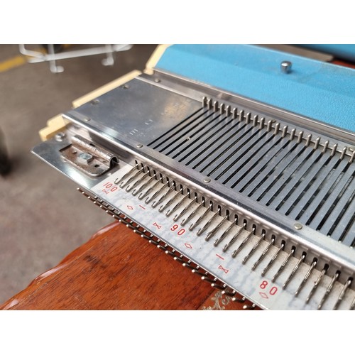 602 - A Jones KH-588 knitting machine, model number 4087175 dating to the 1960's in a lovely sky blue carr... 