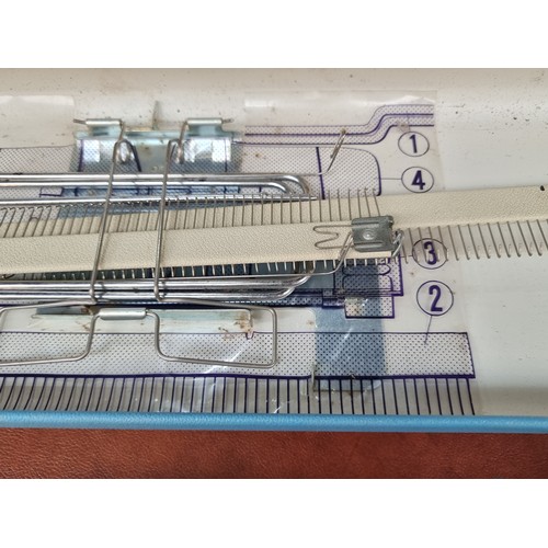 602 - A Jones KH-588 knitting machine, model number 4087175 dating to the 1960's in a lovely sky blue carr... 