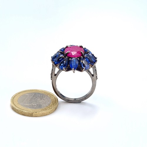 1 - Star Lot : A fabulous Ruby and Kyanite floral cluster ring, this stunning ring features a bright cen... 