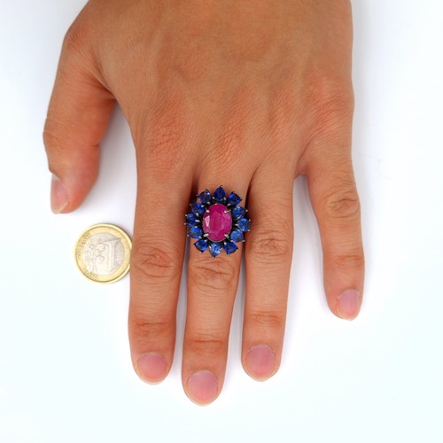 1 - Star Lot : A fabulous Ruby and Kyanite floral cluster ring, this stunning ring features a bright cen... 