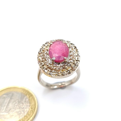 2 - Star Lot : A beautiful example of a Ruby stone ring, featuring an array of channel cut gem stone sur... 