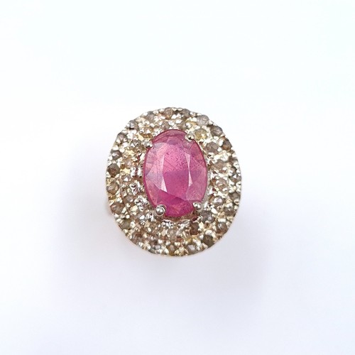 2 - Star Lot : A beautiful example of a Ruby stone ring, featuring an array of channel cut gem stone sur... 