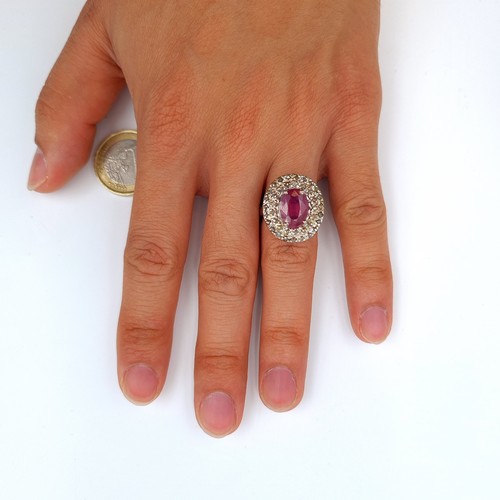 2 - Star Lot : A beautiful example of a Ruby stone ring, featuring an array of channel cut gem stone sur... 