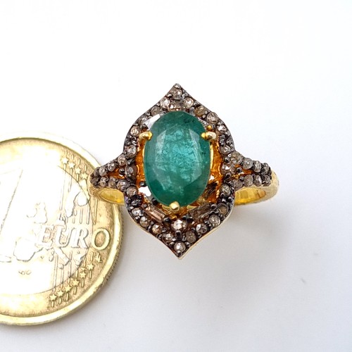 3 - Star lot : A striking Marquise Emerald and Diamond ring, set beautifully with an intricate mount and... 