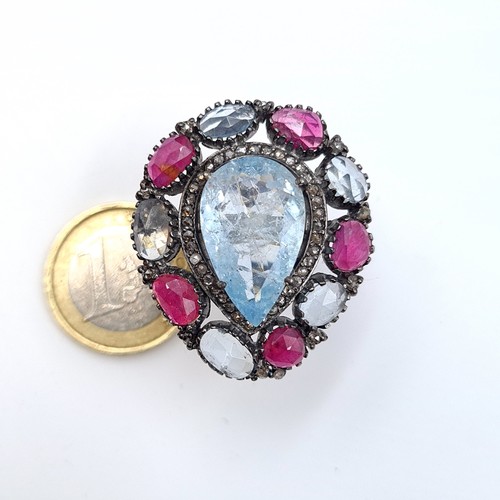 4 - Star Lot : An impressive Aquamarine, Ruby and Diamond floral ring, featuring a large tear drop cut c... 