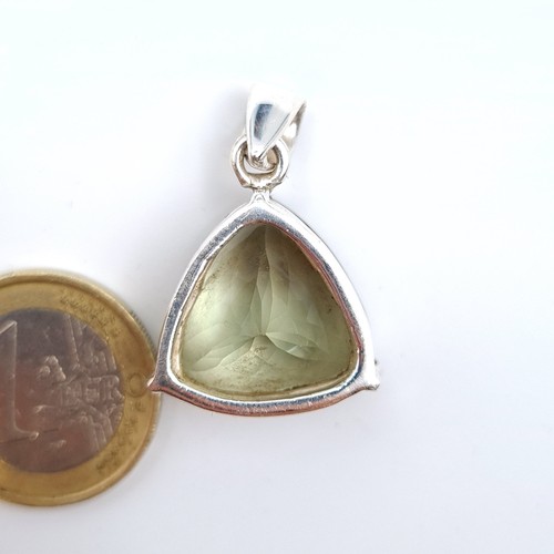 13 - An unusual bright Green Amethyst gem stone pendant, which has a stunning hue and is mounted in sterl... 