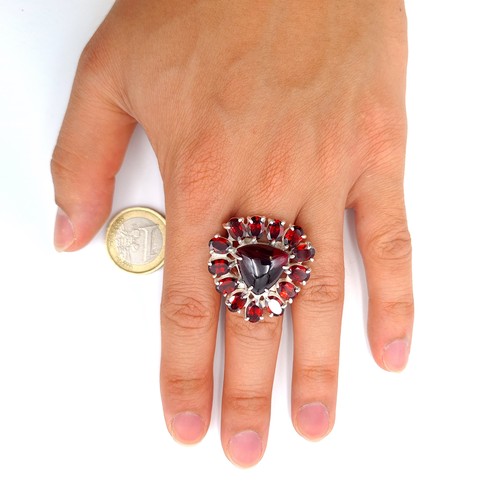 12 - Star Lot : A striking and unusual example of an Amethyst and  Garnet stone cocktail ring, featuring ... 