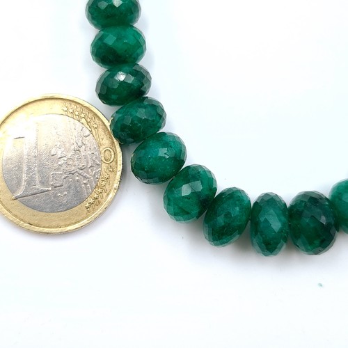 14 - Star Lot : An impressive example of a graduated natural Emerald stone necklace, set with a large 250... 