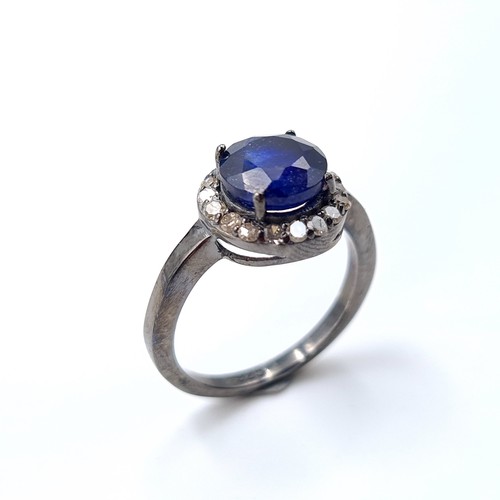 15 - Star Lot : A mesmerising natural Blue Sapphire and Diamond ring, featuring a cushion cut centre ston... 