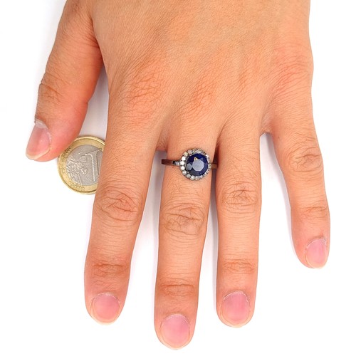 15 - Star Lot : A mesmerising natural Blue Sapphire and Diamond ring, featuring a cushion cut centre ston... 