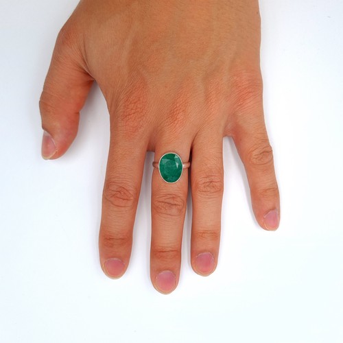 20 - A suite of Emerald jewellery, comprising of a pair of sterling silver tear drop earrings and a prett... 