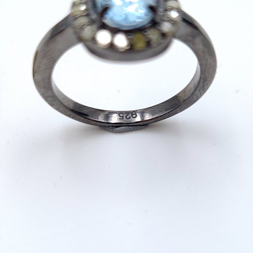 23 - A certified natural Blue Topaz and Diamond ring, with a central Topaz stone of 1.4 carats and a Diam... 