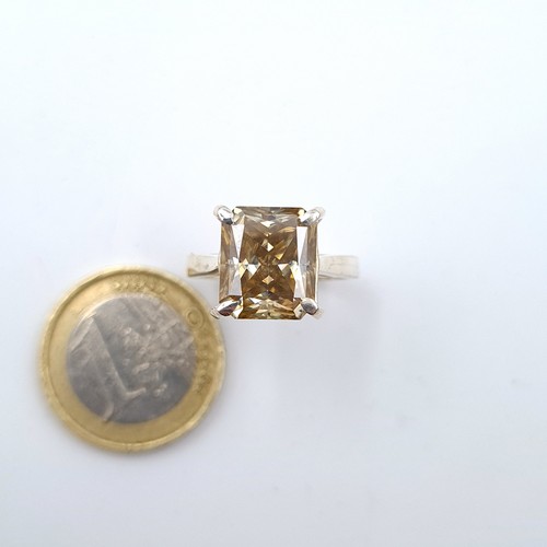 25 - Star Lot : A square cut natural certified Moissanite stone ring, of 5.20 carats and mounted in sterl... 