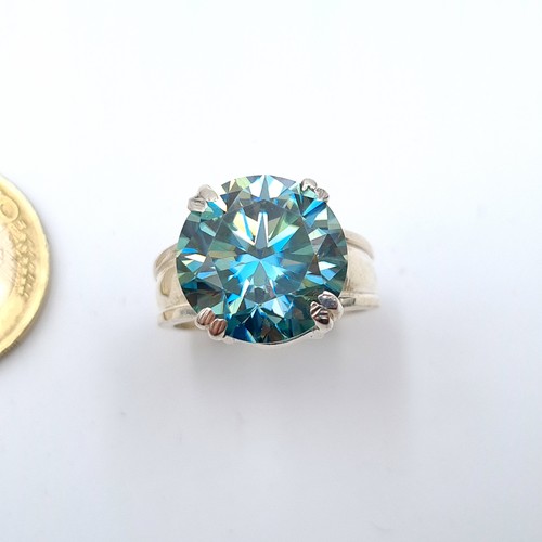 27 - Star Lot : A fully certified vivid Ocean Blue Moissanite stone ring, featuring a central stone of 8.... 