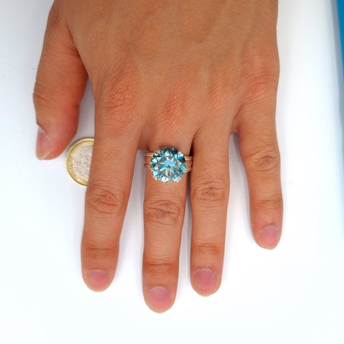 27 - Star Lot : A fully certified vivid Ocean Blue Moissanite stone ring, featuring a central stone of 8.... 