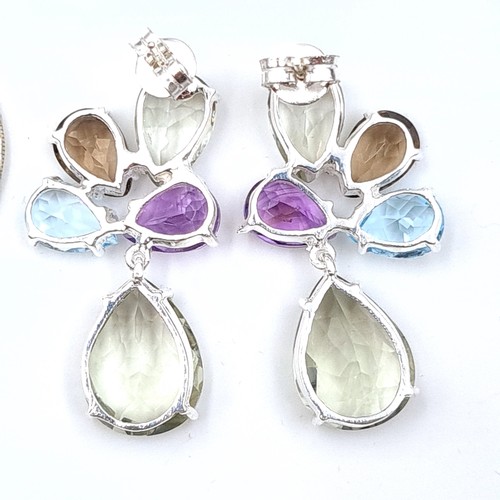 34 - A show stopping pair of Citrine, Blue Topaz, Amethyst and Peridot drop earrings. Set in sterling sil... 