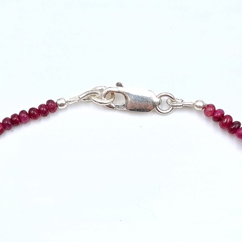 40 - Two items, including a single strand graduated cabochon cut Ruby necklace set with a sterling silver... 