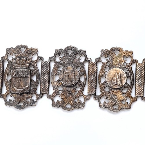 46 - A fabulous example of a vintage intricate eight panel Siam silver bracelet, set with Parisian scenes... 