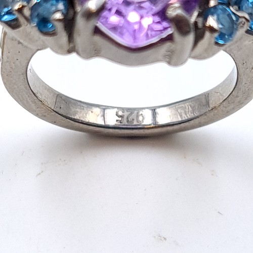 502 - An exquisite natural Amethyst and Blue Topaz ring, featuring a large fabulous central stone of 6.03 ... 