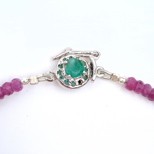 518 - A stunning single strand 105 carat natural Ruby necklace, set with a sterling silver Emerald clasp. ... 