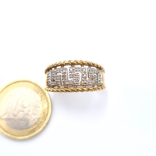 522 - Star Lot: A very attractive 9 carat gold Greek key inspired channel cut Diamond ring. Stamped 375. R... 