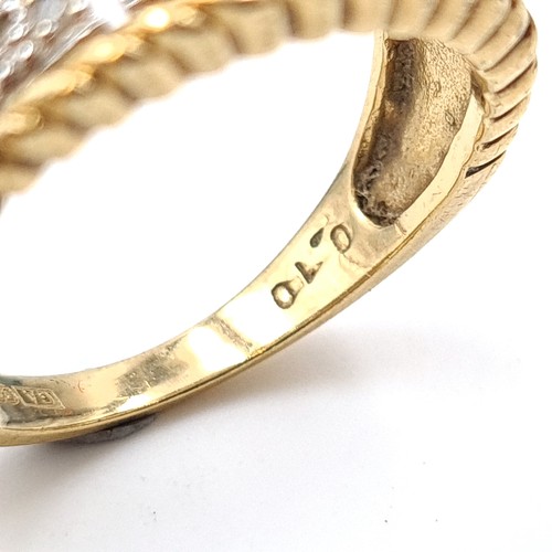 522 - Star Lot: A very attractive 9 carat gold Greek key inspired channel cut Diamond ring. Stamped 375. R... 