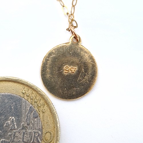 523 - A fine example of a 9 carat gold St Christopher necklace, featuring man and child in a medallion for... 