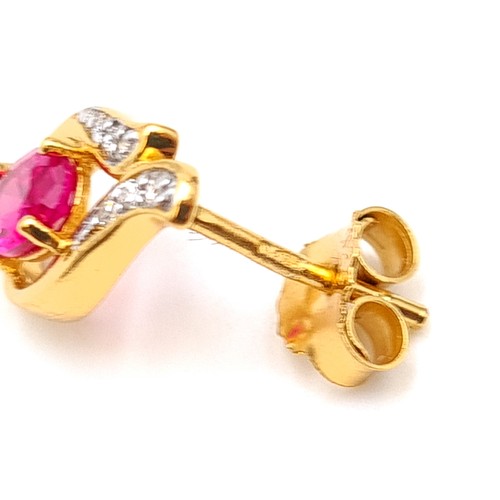 543 - A truly beautiful pair of 9 carat gold plated Ruby abstract inspired stud earrings, with White Sapph... 