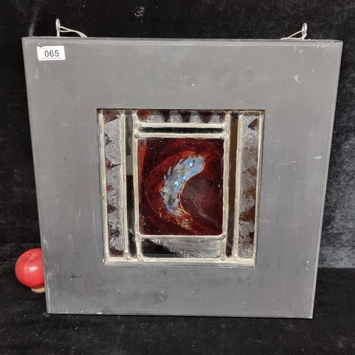 65 - A very heavy handmade original stained glass artwork depicting a fish in motion in tones of blues an... 