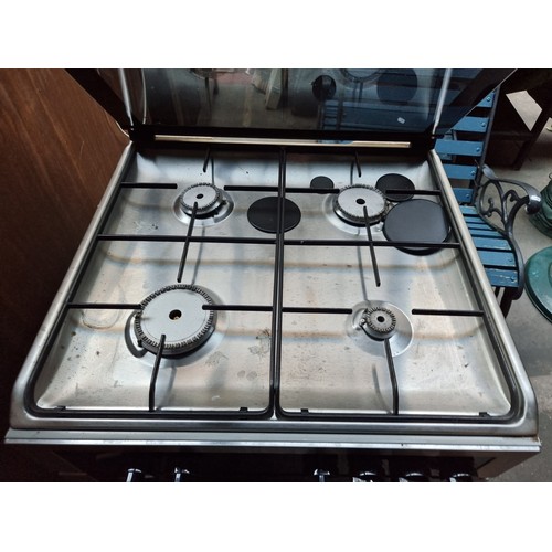 854 - Star lot : A Sauter branded oven with four ring gas hob. Model SCG1010X. This appears to be barely u... 