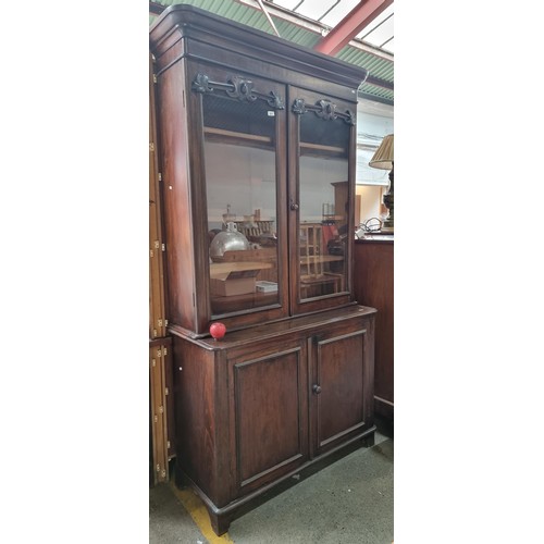 864 - Star lot : An antique 19th century mahogany bookcase. Featuring a glazed book case to top with three... 