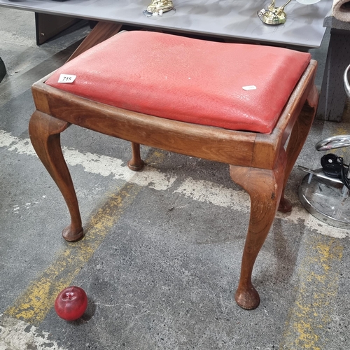 715 - A tall vintage piano stool with bright red leather upholstery and wooden cabriole legs.