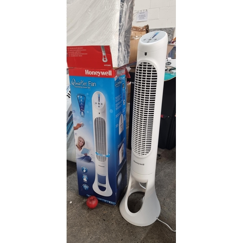 734 - An oscillating tower fan in the Quiet Set series by Honeywell. Model HYF260E featuring five levels o... 