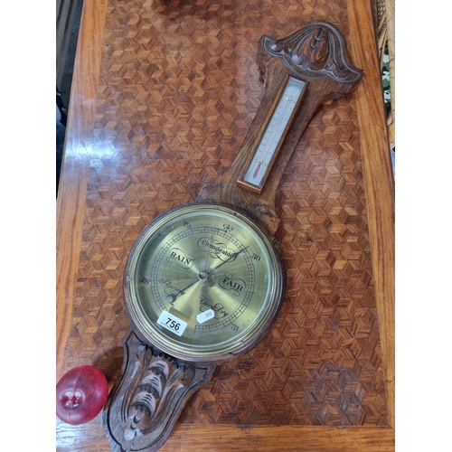 756 - A handsome Victorian carved wood vintage banjo barometer with a heavy oak wood frame featuring a bra... 