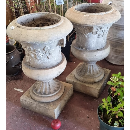 766 - Star Lot - Two large and heavy ceramic outdoor garden planters in the form of neoclassical urns, on ... 