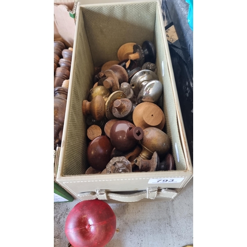 793 - A box filled with vintage and antique door knobs, including turned wood and bakelite examples.