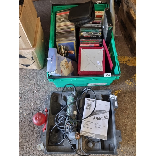 804 - A mixed lot including a Parkside multipurpose tool (PMFW 310 D2), a large number of CD's and other p... 