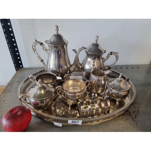 807 - A delightful EPNS tea set with coffee pot, teapot, two lidded bowls, creamer, sugar bowl and toast r... 