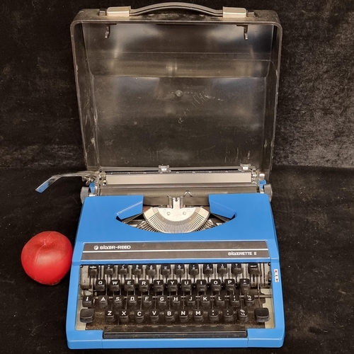 869 - A retro Silver-Reed typewriter model Silverette II. Dating to 1980s. In a vibrant blue shade with ca... 