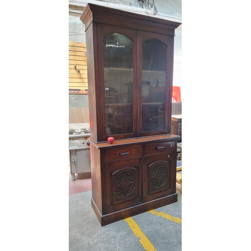 882 - Star Lot : A very large and impressive wooden dresser with glass fronted display cabinet to top hold... 