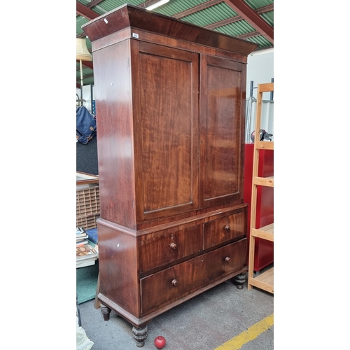 883 - Star lot : A very large Victorian mahogany wardrobe with a large clothes hanging compartment to top ... 