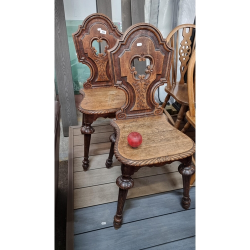 886 - Star lot : A very elegant pair of antique Victorian hall chairs with beautifully carved foliate and ... 