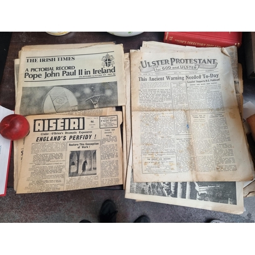 824 - A very interesting collection of twelve Irish newspapers, dating from the 1960's to the 1980's. Incl... 