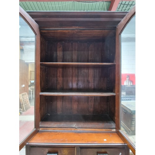 882 - Star Lot : A very large and impressive wooden dresser with glass fronted display cabinet to top hold... 