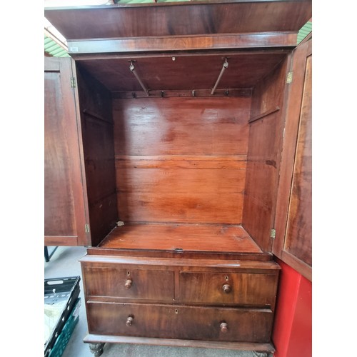 883 - Star lot : A very large Victorian mahogany wardrobe with a large clothes hanging compartment to top ... 