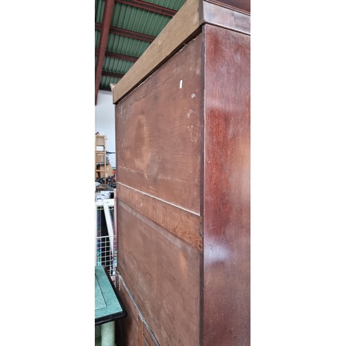 883 - Star lot : A very large Victorian mahogany wardrobe with a large clothes hanging compartment to top ... 